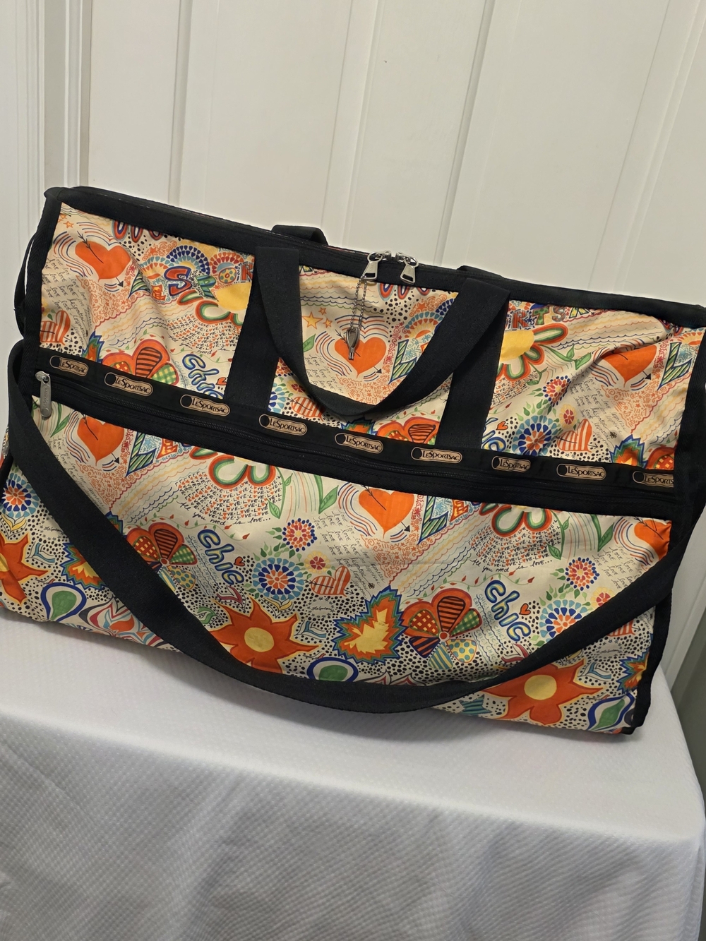 Lesportsac Cream Travel Bag with Orange Floral Print